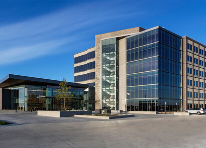 Building with smart windows from left to right on a large modern glass building.