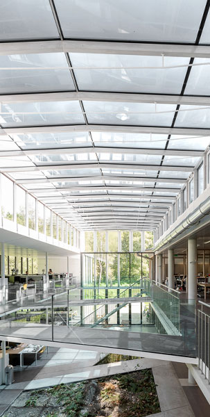 Interior atrium of a glass office building and glass walkways