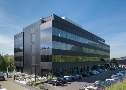 Facade of Jean Singer headquarters, located in Boudry (Switzerland). Building equipped with SageGlass smart windows.