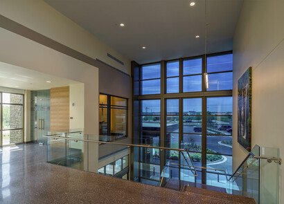 Hallway in building with smart glass windows.