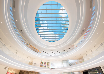 Interior of a multi-level building with smart glass as the ceiling.
