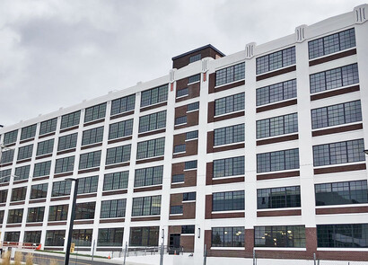Exterior of industrial building with smart glass windows from left to right. 