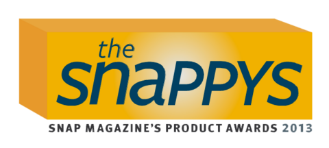 A 3-d gold box with text on the front in greyblue that says "the snappys" and under the box small black text that says "SNAP Magazine's Product Awards 2013"