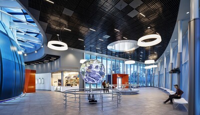 Interior of museum lobby with smart glass windows from floor to ceiling and a world globe in the middle. 