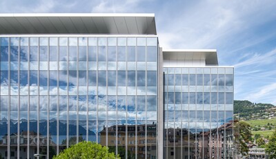 Building with smart windows from left to right on a large modern glass building.