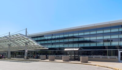 Building facade with smart windows from left to right on a large modern glass building.