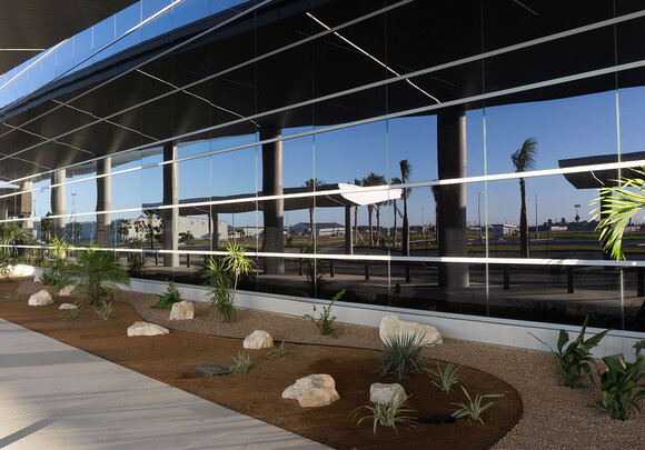 Building with SageGlass smart windows with landscape reflecting off the electrochromic glass.