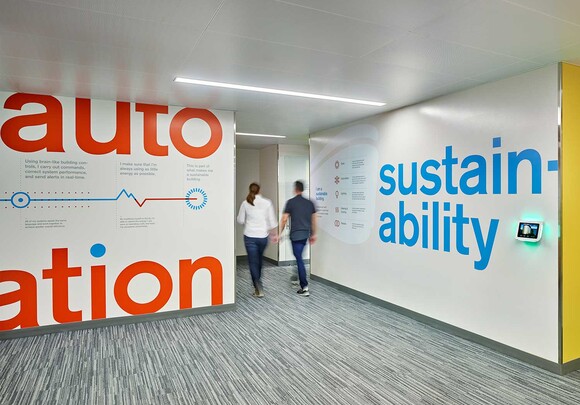 Signage is installed throughout the building to educate occupants about the sustainable technology contributing to net-zero. 