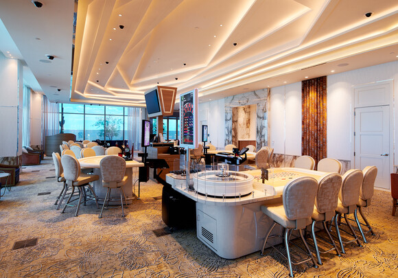 Casino lounge and bar area with large curtain wall. 