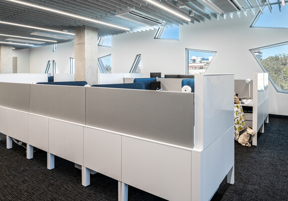 Open-office cubicles offer students and faculty work stations.