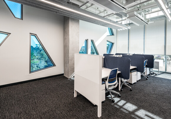 Open-office cubicles offer students and faculty work stations.