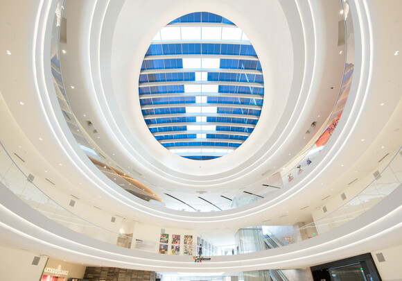 Interior of a multi-level building with smart glass windows as the ceiling.