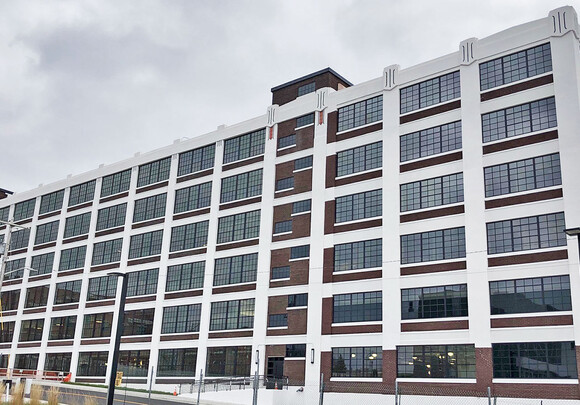 Exterior of industrial building with smart glass windows from left to right. 