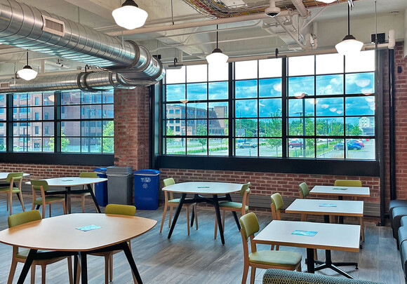 Interior of industrial building common office space with smart glass windows. 