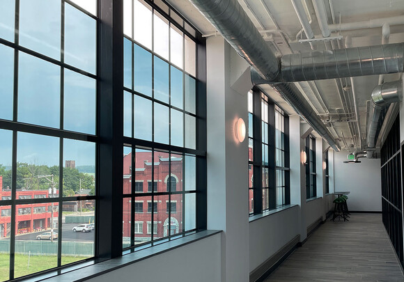 Interior of industrial building with smart glass windows. 