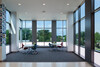Interior common space of office building with huge smart glass windows from left to right. 